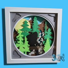 a paper cut out of a bear in the woods