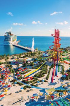 an aerial view of the water park with a cruise ship in the background