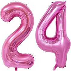 the number two is made out of pink foil balloons