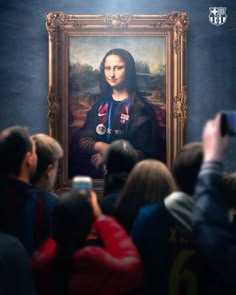 a group of people standing in front of a painting with a woman's face on it