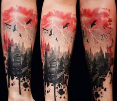 two people with tattoos on their legs are standing in front of a cityscape