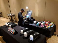 a man standing in front of a table with many items on it