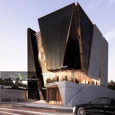 a black car is parked in front of a building with an unusual design on it