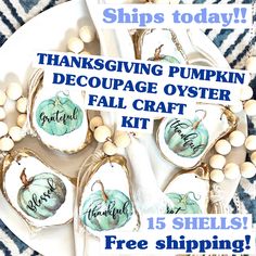 a white plate topped with lots of pumpkins covered in fall crafting supplies and free printable tags