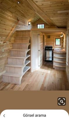 the interior of a tiny house with stairs