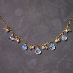 >> Like my design? Follow me on Instagram to stay updated on new design and watch  product video! << http://instagram.com/faithanddeedsjewelry This beautiful necklace is featuring 5 rainbow moonstone briolettes with strong blue flash in them, accompanied by dainty fresh water pearls and citrine quartz. A lovely and understated design for everyday wear.  Moonstones measure approx. 7-8mm tall.  Necklace measures 16 inches long (41cm), comes with an extender that offers extra 2 inches (5cm) extensi Briolette Necklace, Festoon Necklace, Wire Jewelery, Rainbow Moonstone Necklace, Dope Jewelry, Product Video, Fresh Water Pearls, Moonstone Necklace, Water Pearls