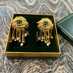 Earrings Without Gift Box Available In Our Closet! Introducing Our Eerie Gold Tassel Victorian Style Eye Earrings; Perfect For Adding A Dash Of Enchantment To Your Style With A Touch Of Elegance And A Mystical Flair. Features: - Green Eye Accent: A Generously Sized Green Eye Accent That Is Sure To Catch The Eye Of Those With A Taste For The Unique. - Dazzling Dangling Tassels: Rhinestones And Simulated Pearls At The Ends For Added Glamour. - Versatile Options: Available In Both Traditional Pierc Victorian Accessories Modern, Cheap Victorian Style Jewelry Gift, Victorian Style Earrings, Gift Box Handmade, Lovers Eyes, Green Eye, Ootd Inspo, Matching Ring, Box Handmade