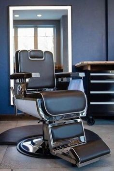 a chair that is sitting in the middle of a room with blue walls and drawers