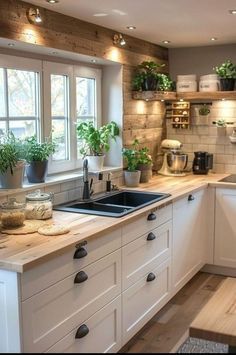 a kitchen filled with lots of counter top space next to a stove top oven and sink