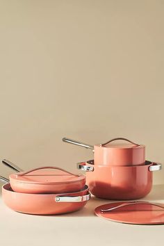 pink pots and pans with silver handles