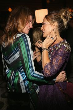 two women hugging each other at a party