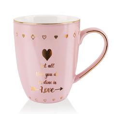 a pink coffee cup with gold trim and hearts on the side, says it all that you are done in love