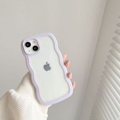 a person holding an iphone case in their hand