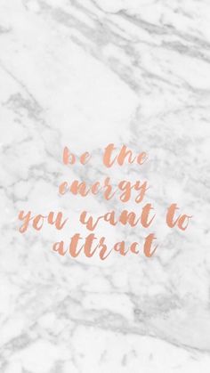 the words be the energy you want to attract on a marble background with copper foil