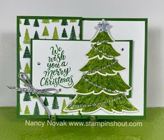 a christmas card with a green tree on it