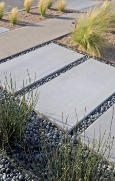 a walkway made out of stones and gravel