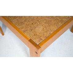 a close up of a wooden table with cork on it's top and bottom