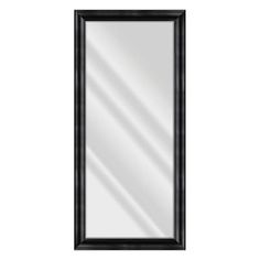 a black framed mirror on a white wall