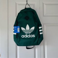 A Green Adidas Backpack Is A Stylish And Practical Accessory For Your Daily Needs. Adidas Is Known For Its Quality And Sporty Designs, And This Backpack Is No Exception. The Green Color Adds A Pop Of Vibrancy, Making It A Fashionable Choice For Carrying Your Essentials. Whether You're Using It For School, Work, Or As A Gym Bag, This Adidas Backpack Offers Both Functionality And Style. Embrace The Sporty-Chic Aesthetic And Practicality Of This Green Backpack, And Enjoy A Versatile Addition To You Casual Travel Backpack With Logo, Green Bags For Back To School Streetwear, Sporty Green Backpack For Back To School, School Backpack With Logo, Sporty Green Backpack For School, Casual Backpack With Logo For Daily Use, Casual Logo Backpack For Everyday Use, Casual Nylon Backpack With Logo, Casual Everyday Backpack With Logo