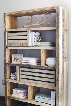 an old wooden shelf with books on it