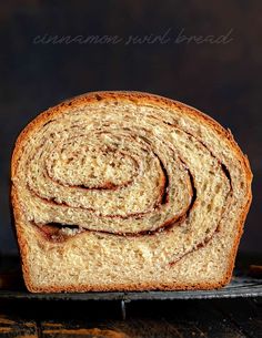 a loaf of cinnamon swirl bread on a cooling rack