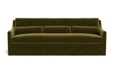 a green couch sitting on top of a white floor