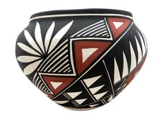 a black and white vase with geometric designs on it's sides, isolated against a white background