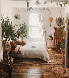 a bedroom with lots of plants in it