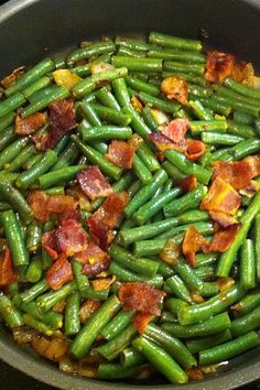 green beans and bacon cooking in a skillet