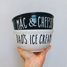 a hand holding up a bowl that says mac and cheese dad's ice cream