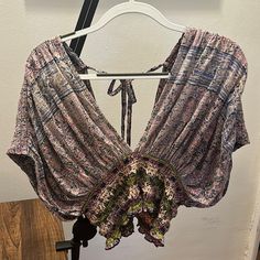 Brand: Free People Type: Crop Top, Short Sleeves Size: L Color: Purple & Pink W/ Pattern Material: 62% Cotton & 38% Modal Condition: New, Never Worn Purple V-neck Beach Top, Floral Print Lavender Top For Vacation, Lavender Floral Print Top For Vacation, Purple Floral Print Summer Top, Summer Floral Print Purple Tops, Summer Purple Floral Print Top, Lavender V-neck Top For Vacation, Purple V-neck Top For Vacation, Purple V-neck Top For Summer