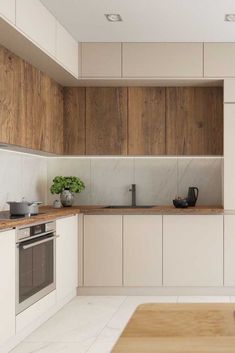 a kitchen with wooden cabinets and white counter tops, along with a stove top oven