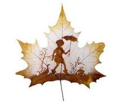 a leaf with a silhouette of a person carrying a basket on it's back