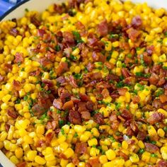 corn with bacon and parsley in a white bowl