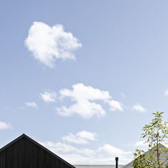 a black building with a clock tower in the background