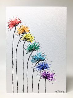 a card with colorful flowers painted on it