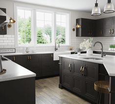 a kitchen with black cabinets and white counter tops