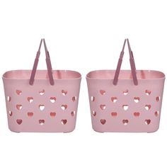 two pink baskets with hearts cut out on the sides and handles, one is empty