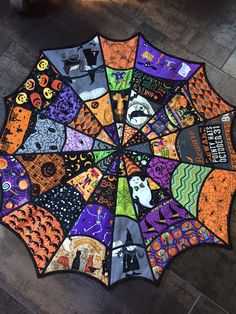 an umbrella decorated with halloween images on it