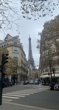 the eiffel tower towering over the city of paris, from across the street