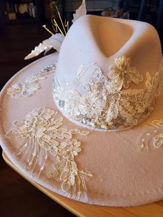 Stunning one of a kind fedora. This white on white hat has been embellished with beautiful elements, including sequined applique, silk sari ribbon and a vintage satin lily (NOS). All embellishments are hand sewn by me. No glue had been used in this piece. Fits S-M, with a ribbon on the inside band for adjustment. Country Western Wedding, Arizona Style, Cadet Hat, Dressing Ideas, Sari Ribbon, Felt Cowboy Hats, Kentucky Derby Party