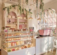 a bakery filled with lots of cakes and cupcakes