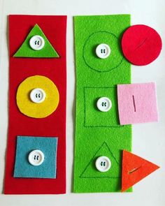 two pieces of felt with buttons on them, one is green and the other is red