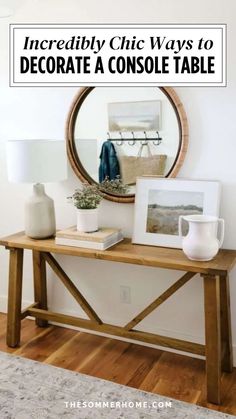 a console table with white vases on top and a round mirror above it that says incredibly chic ways to decorate a console table