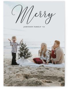 a family is sitting on the beach in front of a christmas tree and it says, wonders