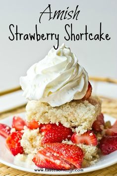 a close up of a plate of food with strawberries on it and the words amish strawberry shortcake