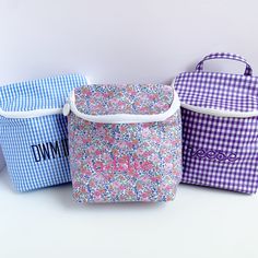 Perfect for lunch, beverages and bottles! Our cute Take Away insulted bag comes in a handy size with a 2 way, heavy duty zip, inside mesh pocket and top loop handle for grab and go! style. Signature wipeable coated cotton outside and lined in wipeable sheeting inside. Available in Garden Floral, as well as Royal, Sky, Pink, and Lavender Ginghams Size: 8"w x 3"d x 10"h Care: Wipe gently with a soft cloth Price includes standard monogram or font. *These are not stocked. Please contact about orderi Lunch Beverages, Sky Pink, Pink And Lavender, Insulated Bag, 2 Way, Diaper Bag, Gingham, 3 D, Heavy Duty