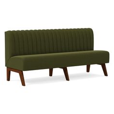 a green couch sitting on top of a wooden leg rester in front of a white background