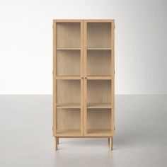 a wooden bookcase with four shelves on one side and two doors on the other