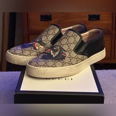 Gucci Gg Supreme Web Accent Dublin Men’s Slip-On Sneakers Size Uk 10 Us 11 Serial # 497105 10 030 Size Uk 10 Us 11 Made In Italy Retails $980 Up For Your Pleasure Is A Gorgeous Pair Of Preowned Gucci Gg Supreme 18ss Animal Wolf Disambiguation Men’s Slip On Sneakers Size 10 G 11 Us, Made Italy In Very Great Condition. The Soles Have Minor Soiling And Some Light Wear. The Uppers Are Clean And Beautiful With No Signs Of Scuff, Discoloration And Creasing To The Leather. Heel Height Measures Approximately 1.25". Please I Strongly Recommend That You View All The Pictures Provided And Ask Questions Whenever In Doubt Before You Make A Purchase. Shoe Comes With Original Gucci Shoe Box An Gucci Shoe, On Sneakers, Gucci Shoes, Slip On Sneakers, Shoe Box, Loafer Shoes, Dublin, Happy Shopping, Heel Height